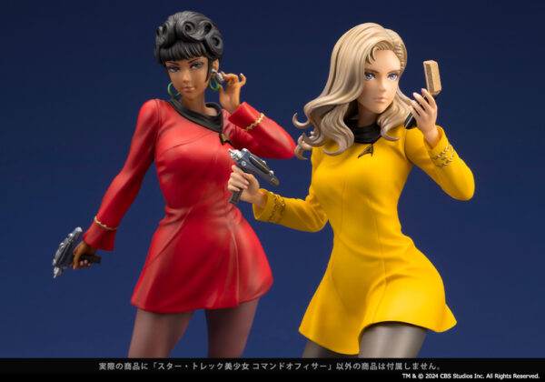 Close-up of two Star Trek: The Original Series Bishoujo statues featuring characters in command roles. The figure on the left is Uhura and she wears a red uniform and holds a phaser, while the Command Officer figure on the right wears a yellow uniform and holds a communicator. Both statues are intricately detailed, capturing the essence of the characters with dynamic poses and expressive facial features.