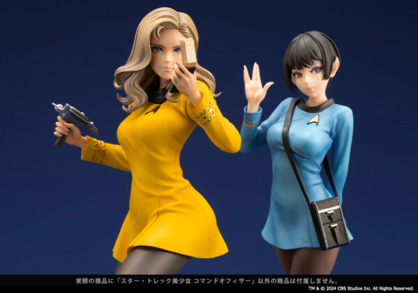 Close-up of two Star Trek: The Original Series Bishoujo statues featuring a command officer in a yellow uniform holding a phaser and communicator, and a Vulcan science officer in a blue uniform giving the Vulcan salute. Both figures are intricately detailed and posed dynamically, reflecting the characters' iconic roles within the Starfleet.